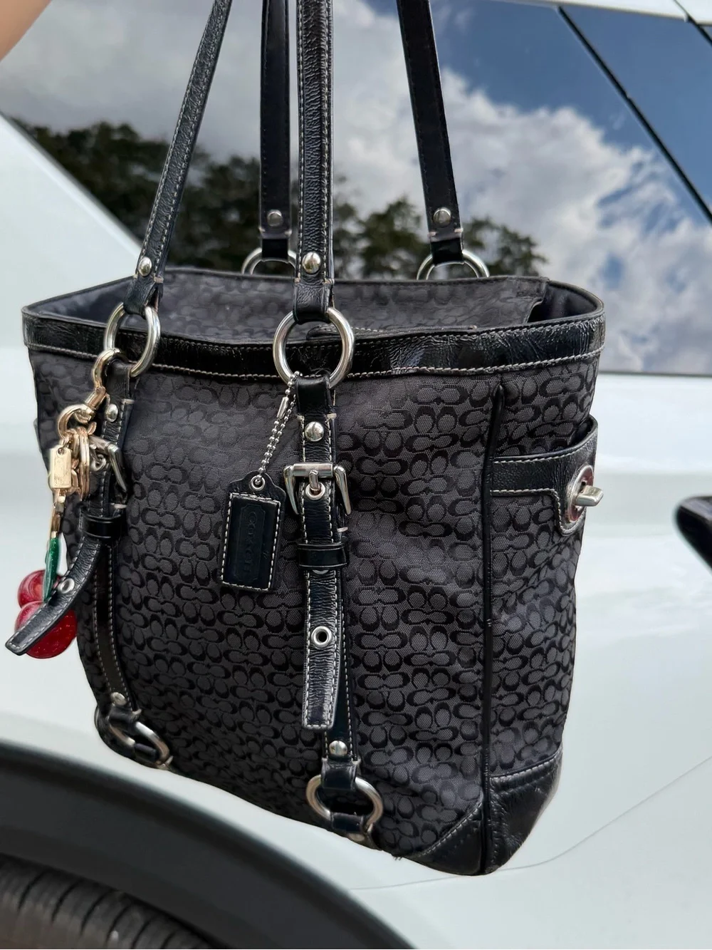 Coach Black Signature Canvas Shoulder Tote with Red Cherry Charm